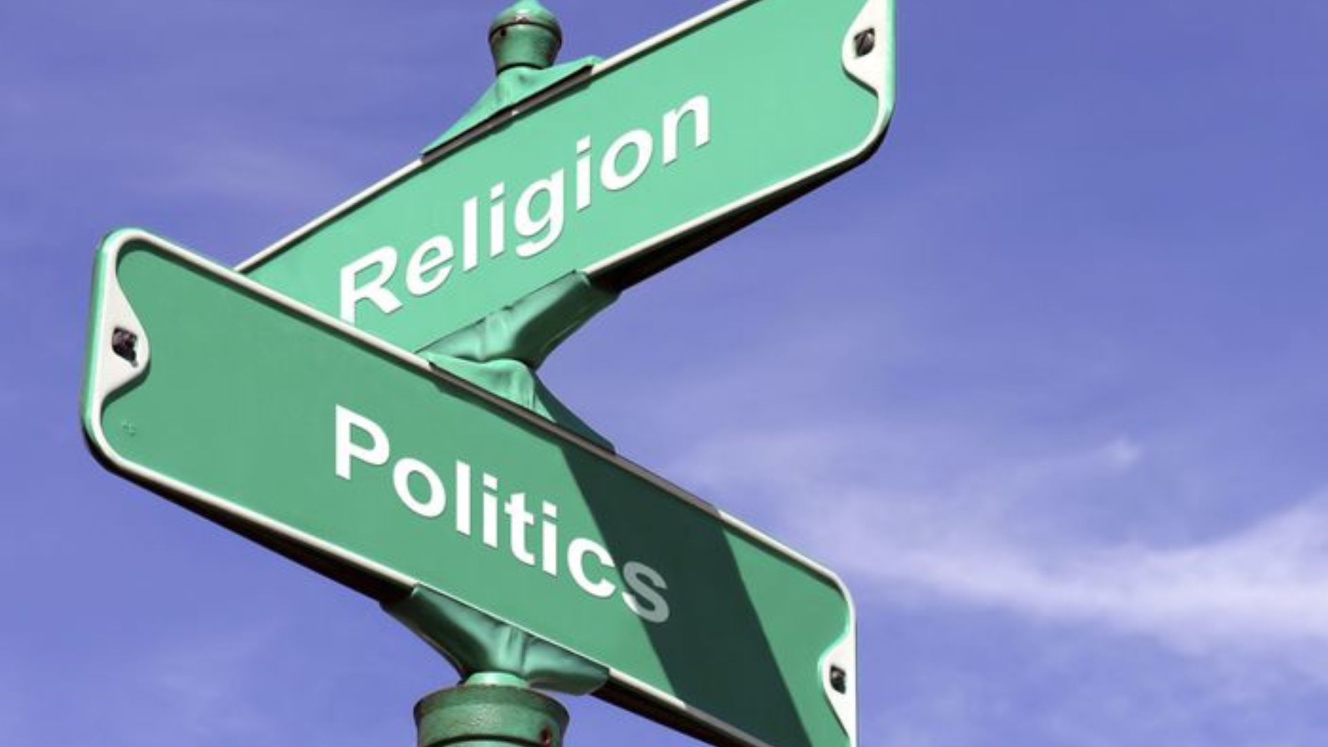 a sign post written religion and politics